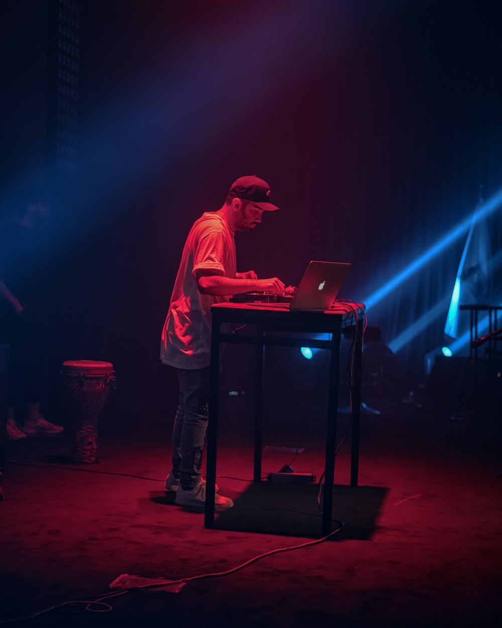 a man standing in front of a laptop computer