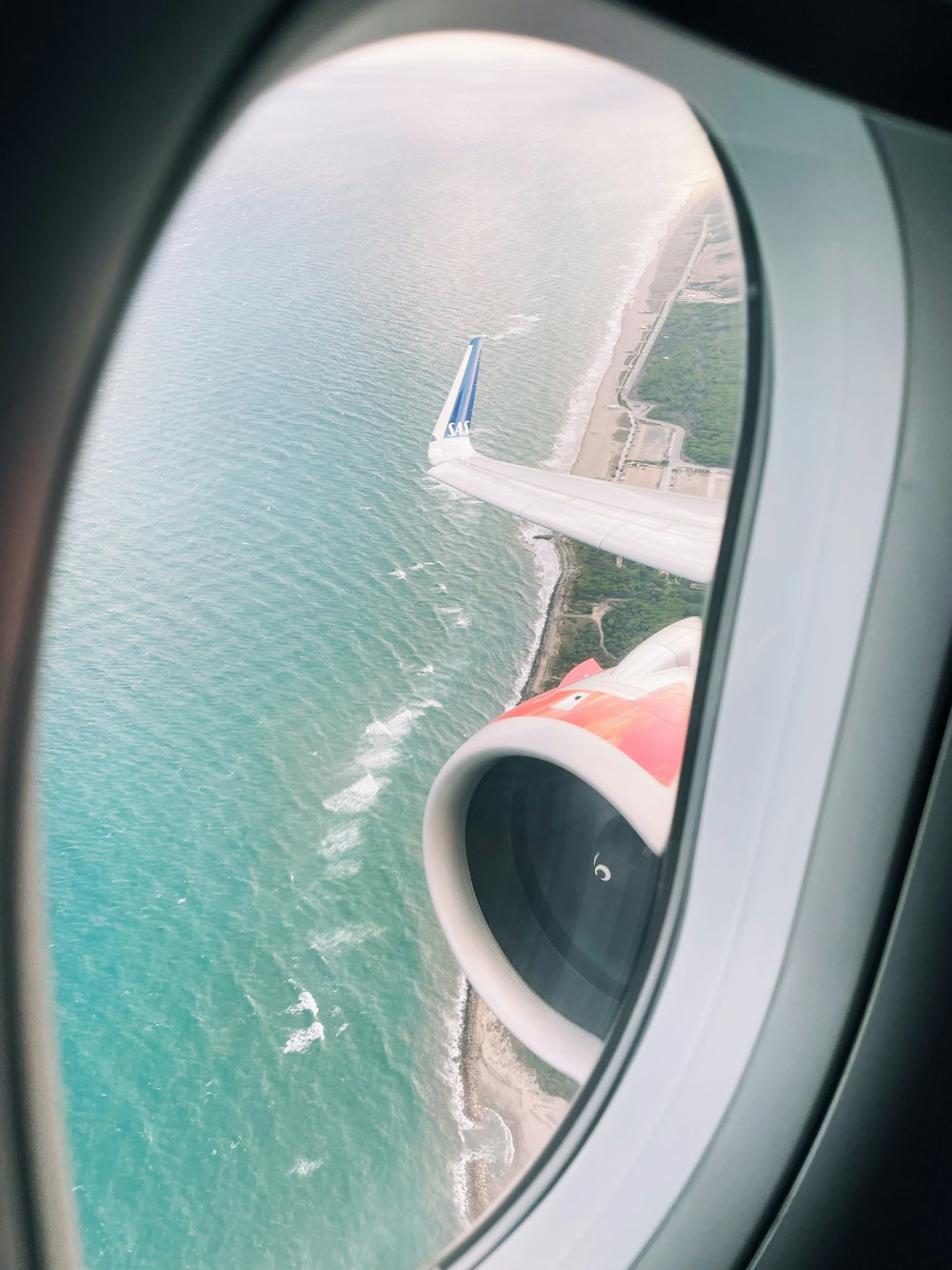 a view of the ocean from an airplane window