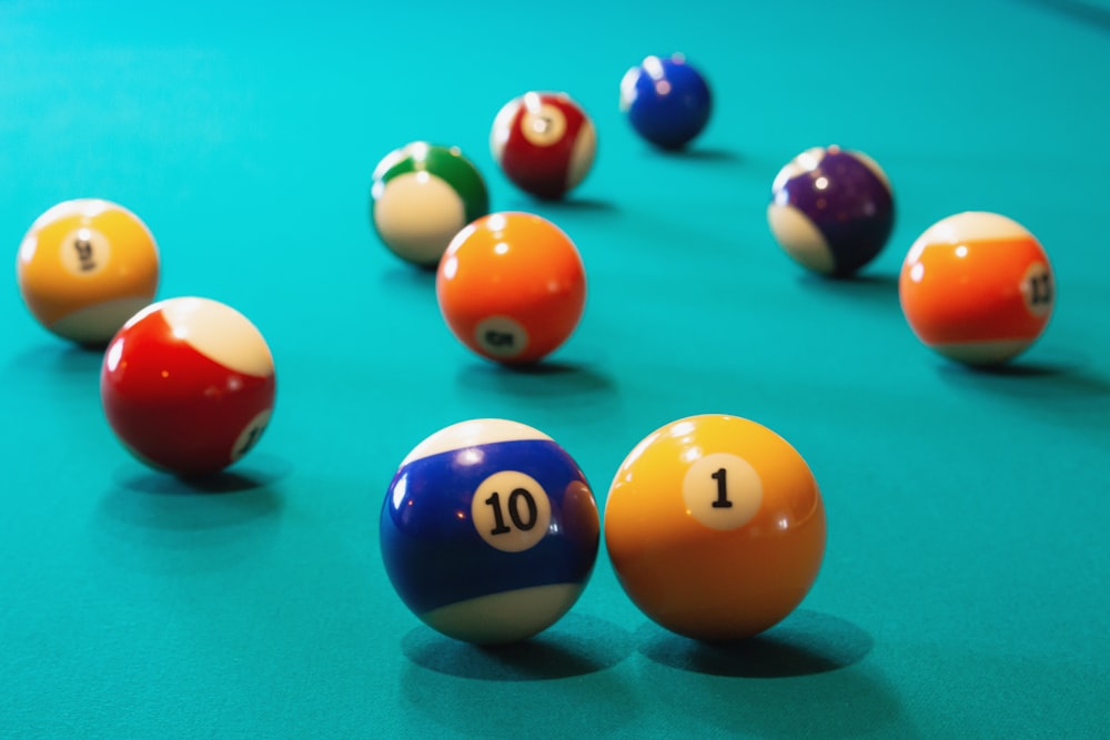 a pool table filled with pool balls and numbers