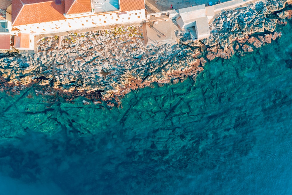 a bird's eye view of a house on the water