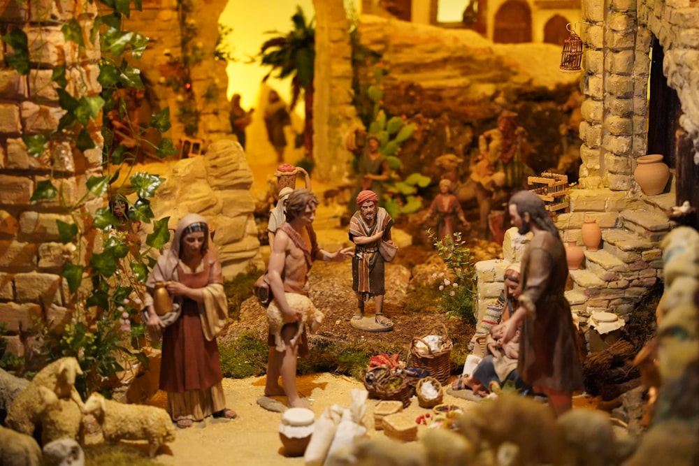 a nativity scene with figurines of people and animals