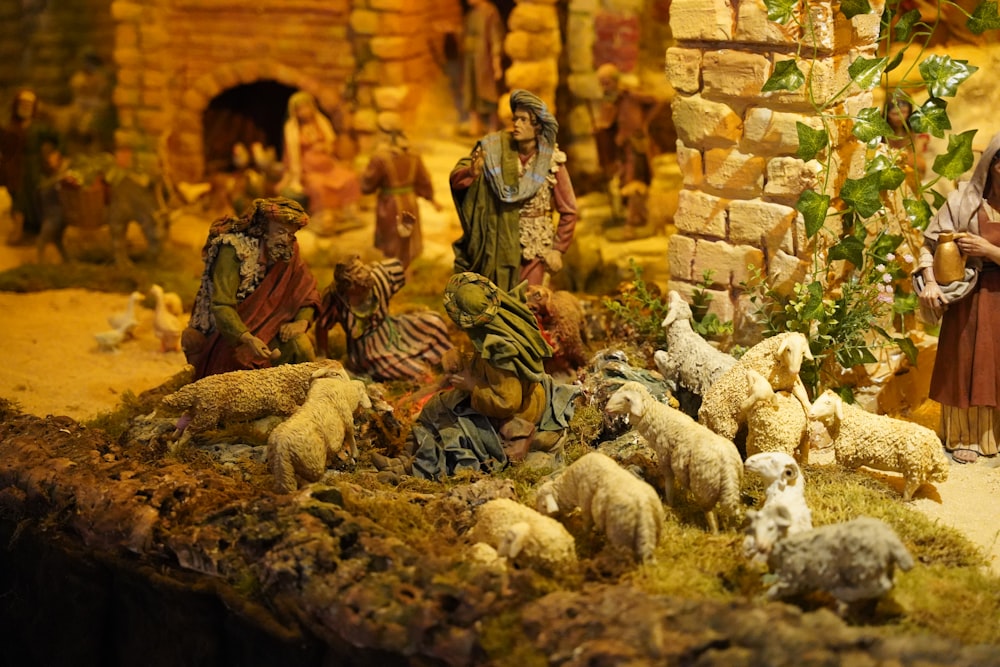 a nativity scene with figurines of people and animals