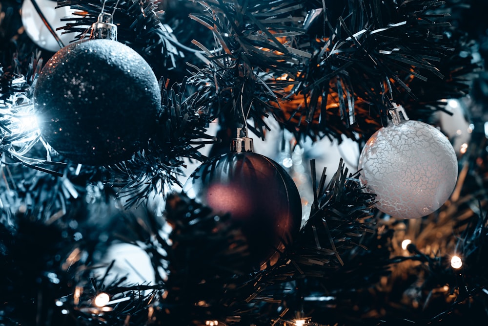 a close up of a christmas tree with ornaments