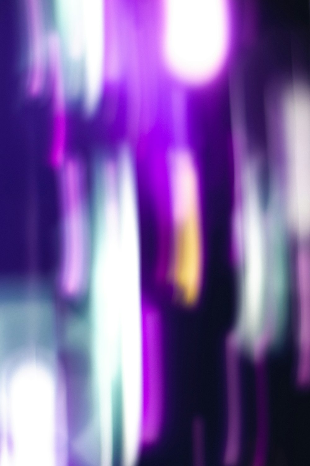 a blurry image of a purple and white background