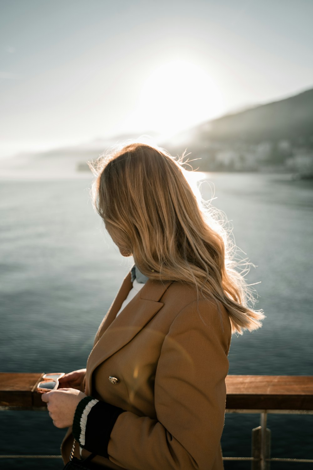 a woman is looking at her cell phone