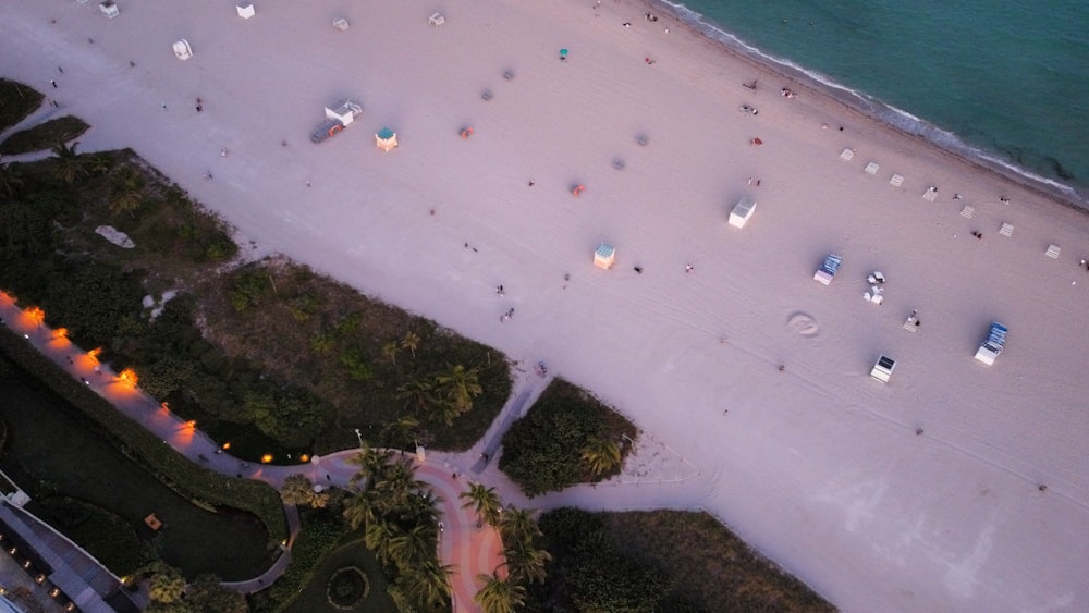 an aerial view of a beach at dusk