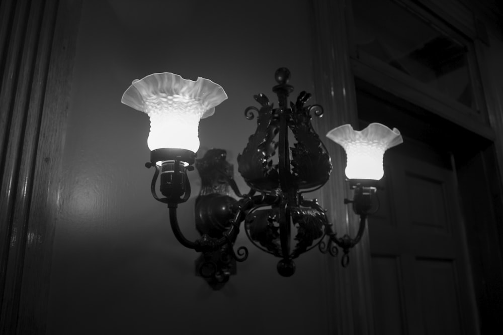 a black and white photo of a chandelier