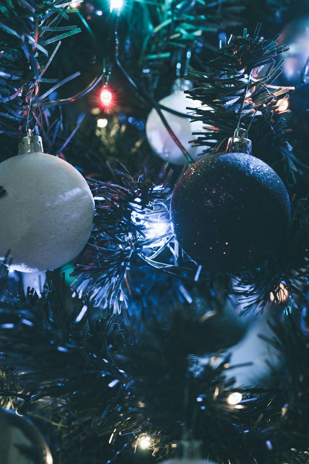 a close up of a christmas tree with ornaments