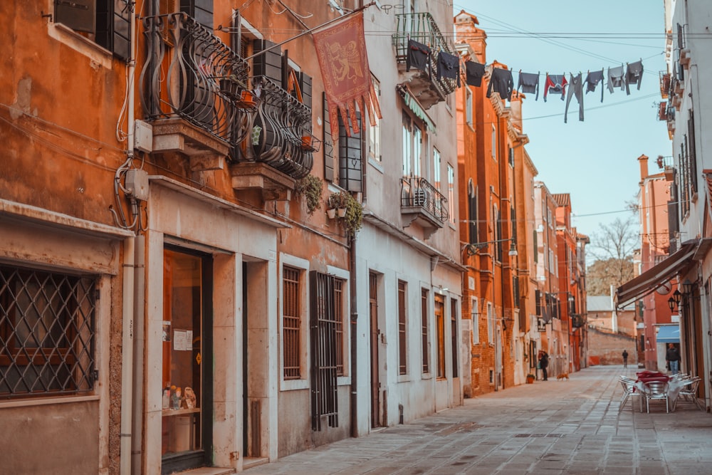 an empty street with a few buildings on both sides