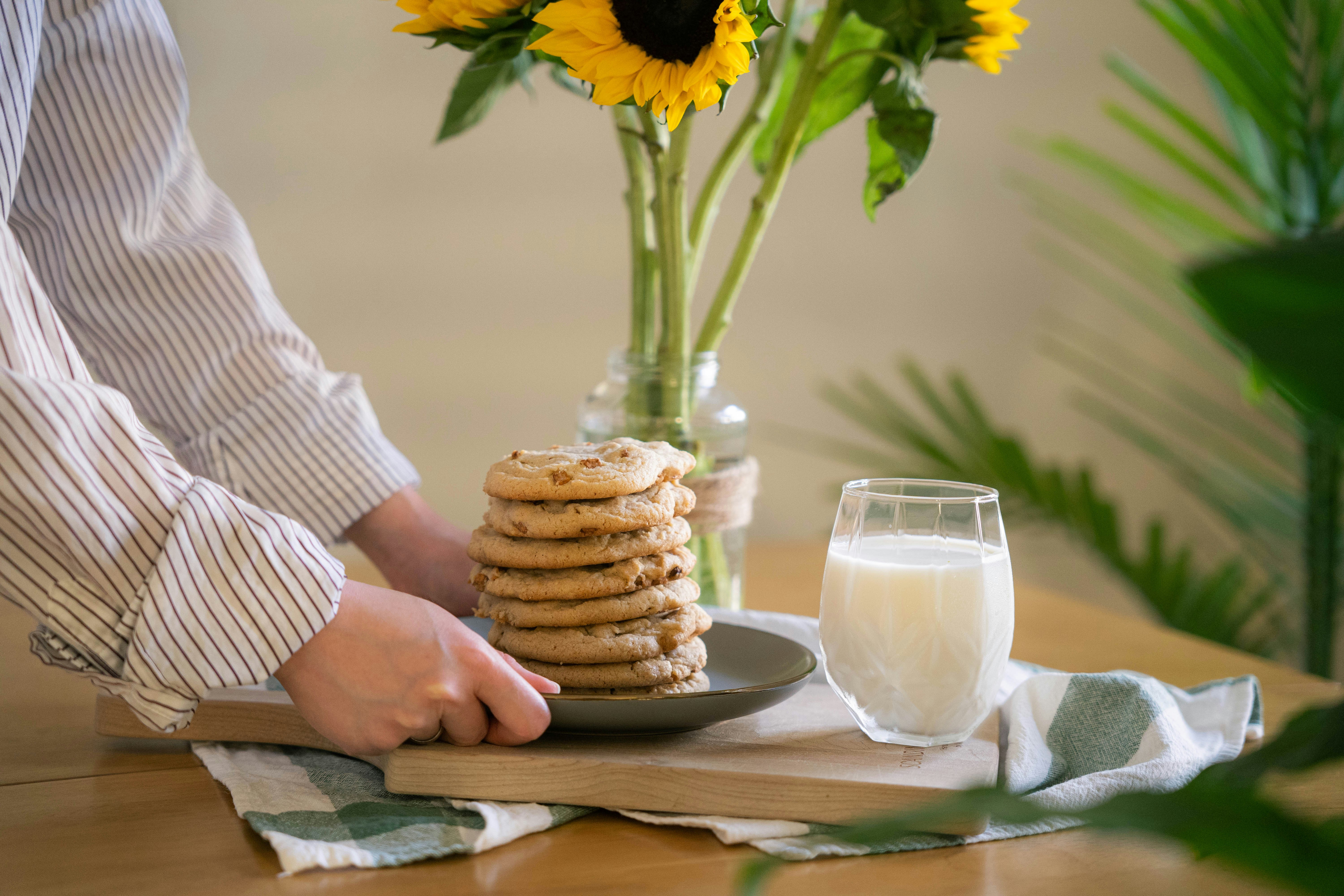Pancake stack with sunflowers and milk