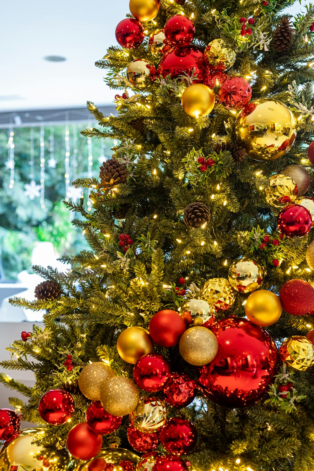 a christmas tree with red and gold ornaments