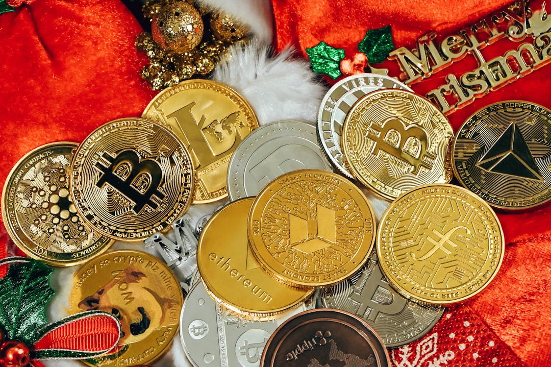 a pile of gold and silver coins sitting on top of a red blanket, A pile of cryptocurrency coins are together on Christma