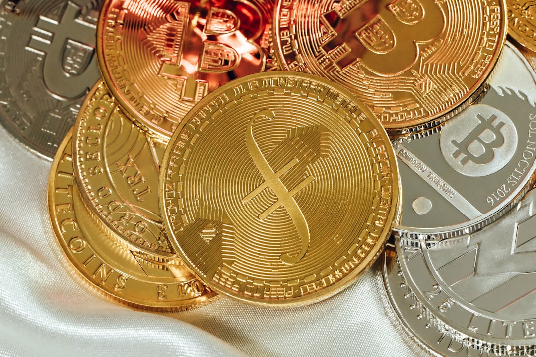 a pile of bitcoins sitting on top of a white cloth, A variety of cryptocurrencies on a white fabric