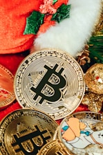a pile of bitcoins sitting next to a christmas tree