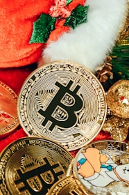 a pile of bitcoins sitting next to a christmas tree