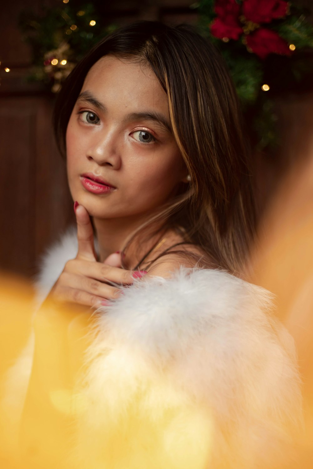 a woman in a fur coat looking at the camera