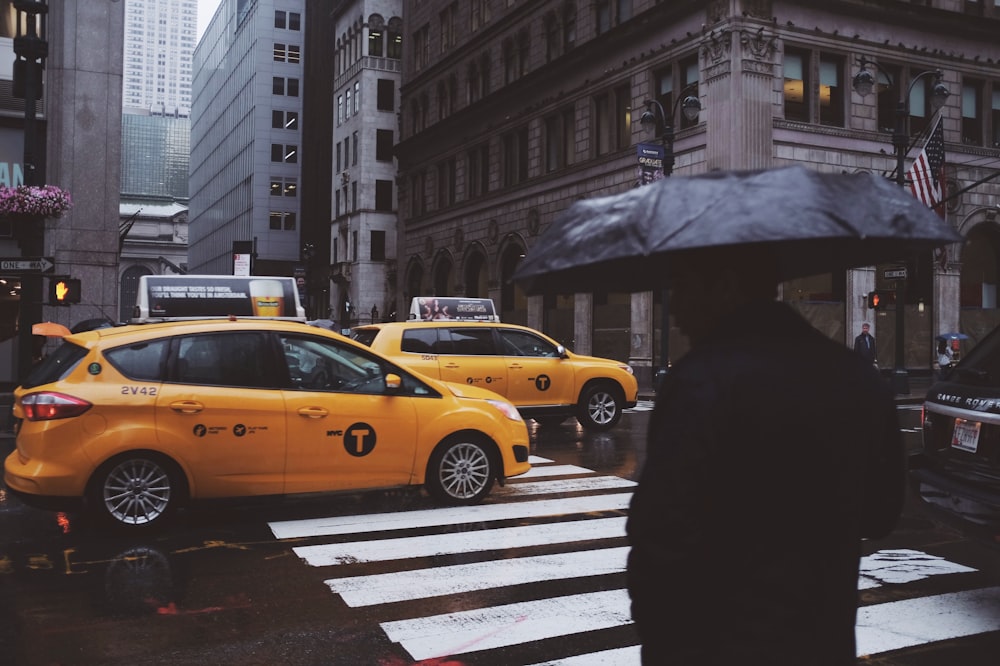 a person holding an umbrella in the rain