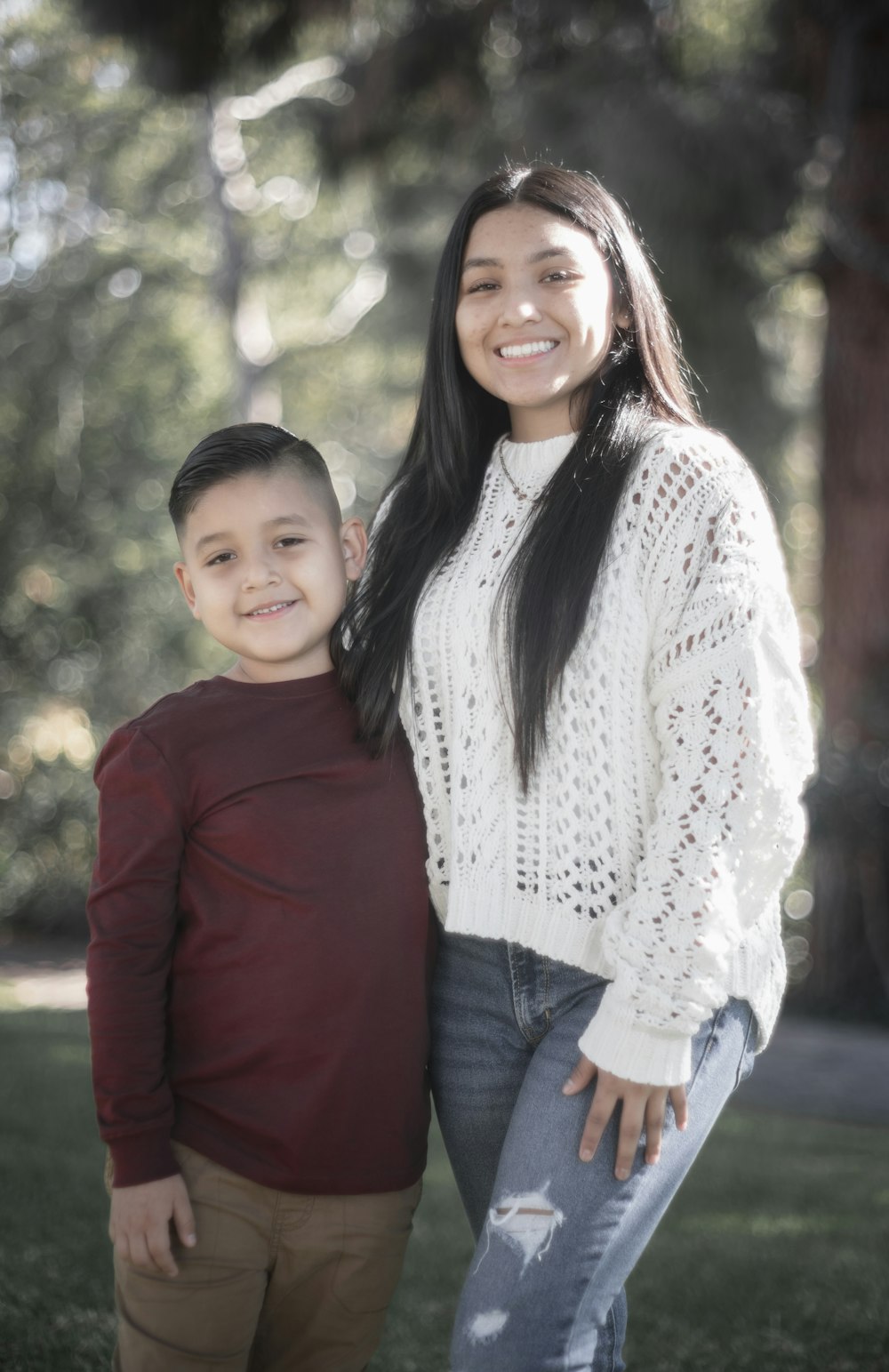 a woman and a boy posing for a picture