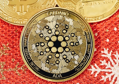 a bitcoin sitting on top of a red and gold background