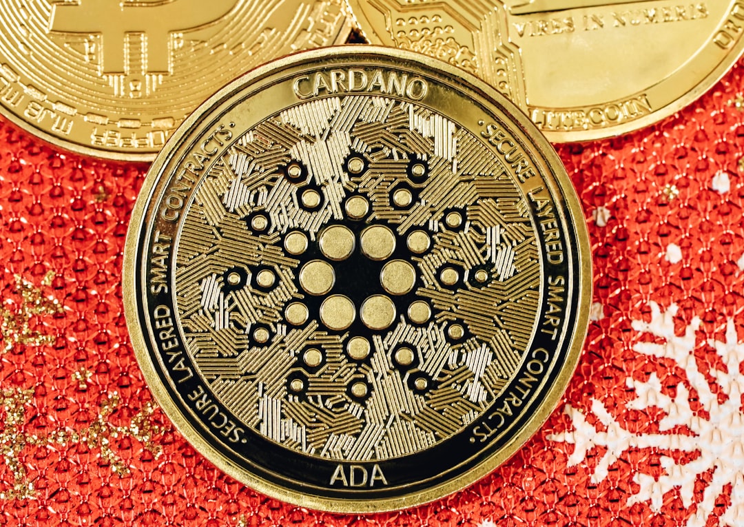 An ADA coin on top of a red Christmas background