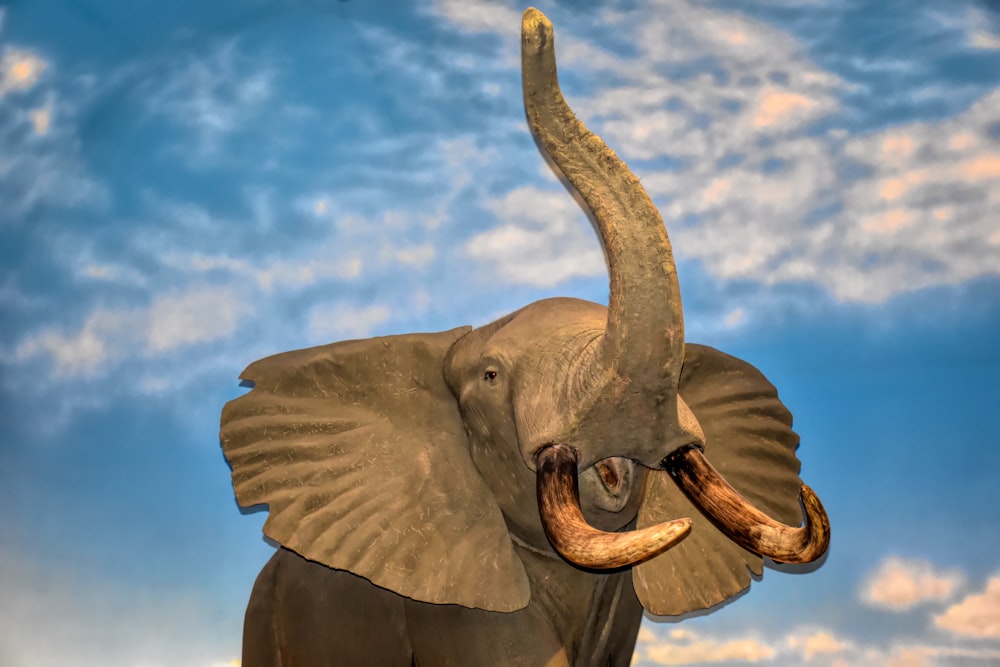 a statue of an elephant with large tusks