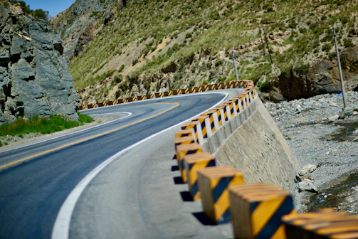 a person riding a skate board on a road