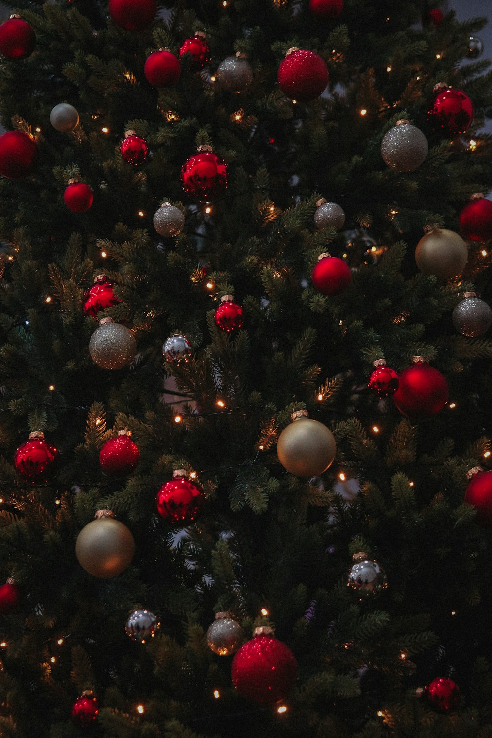 a christmas tree with red and silver ornaments