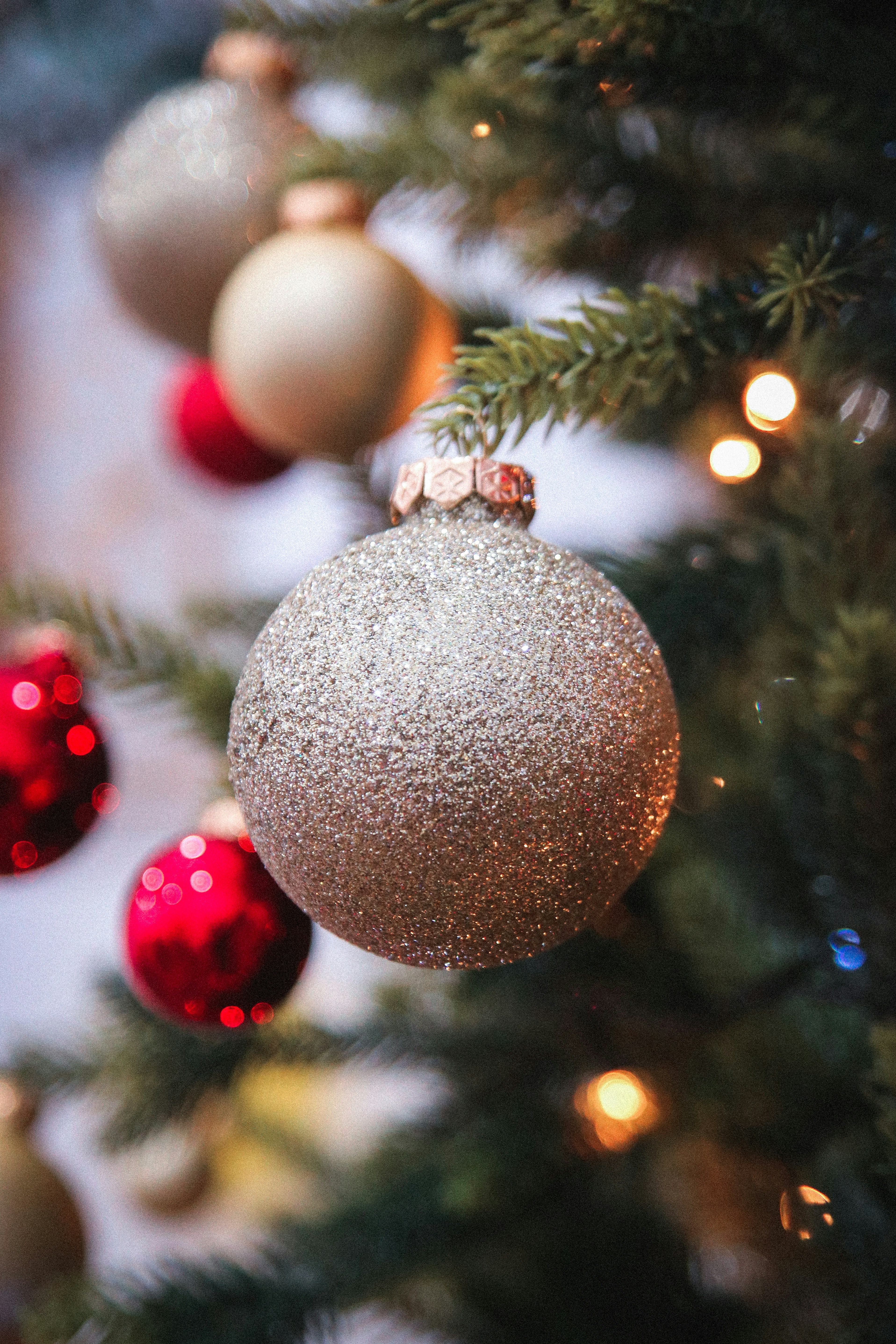 a close up of a christmas tree with ornaments