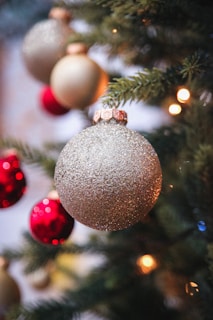 a close up of a christmas tree with ornaments