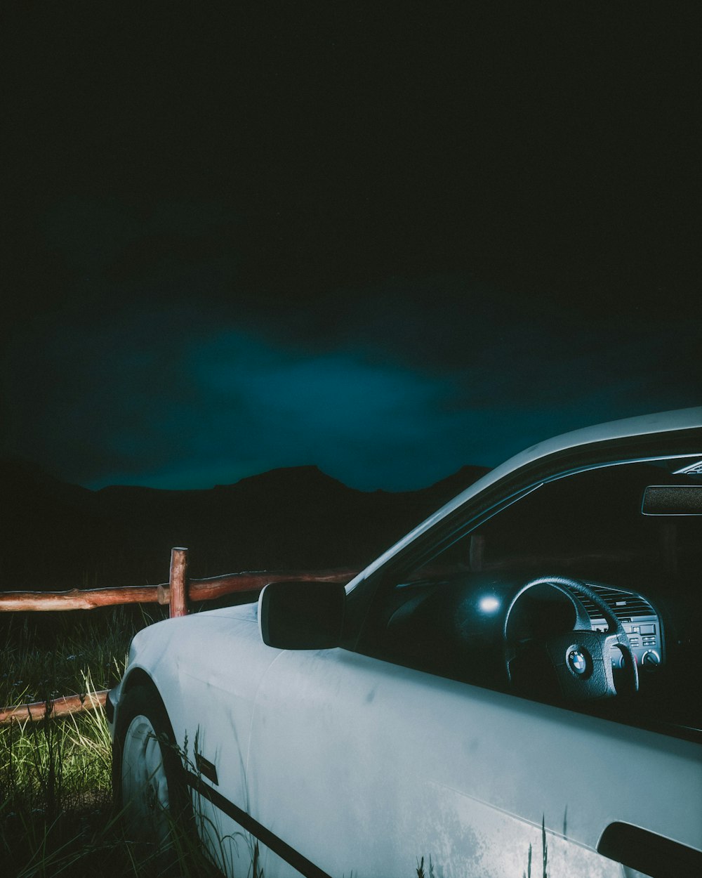 a car parked in a field at night