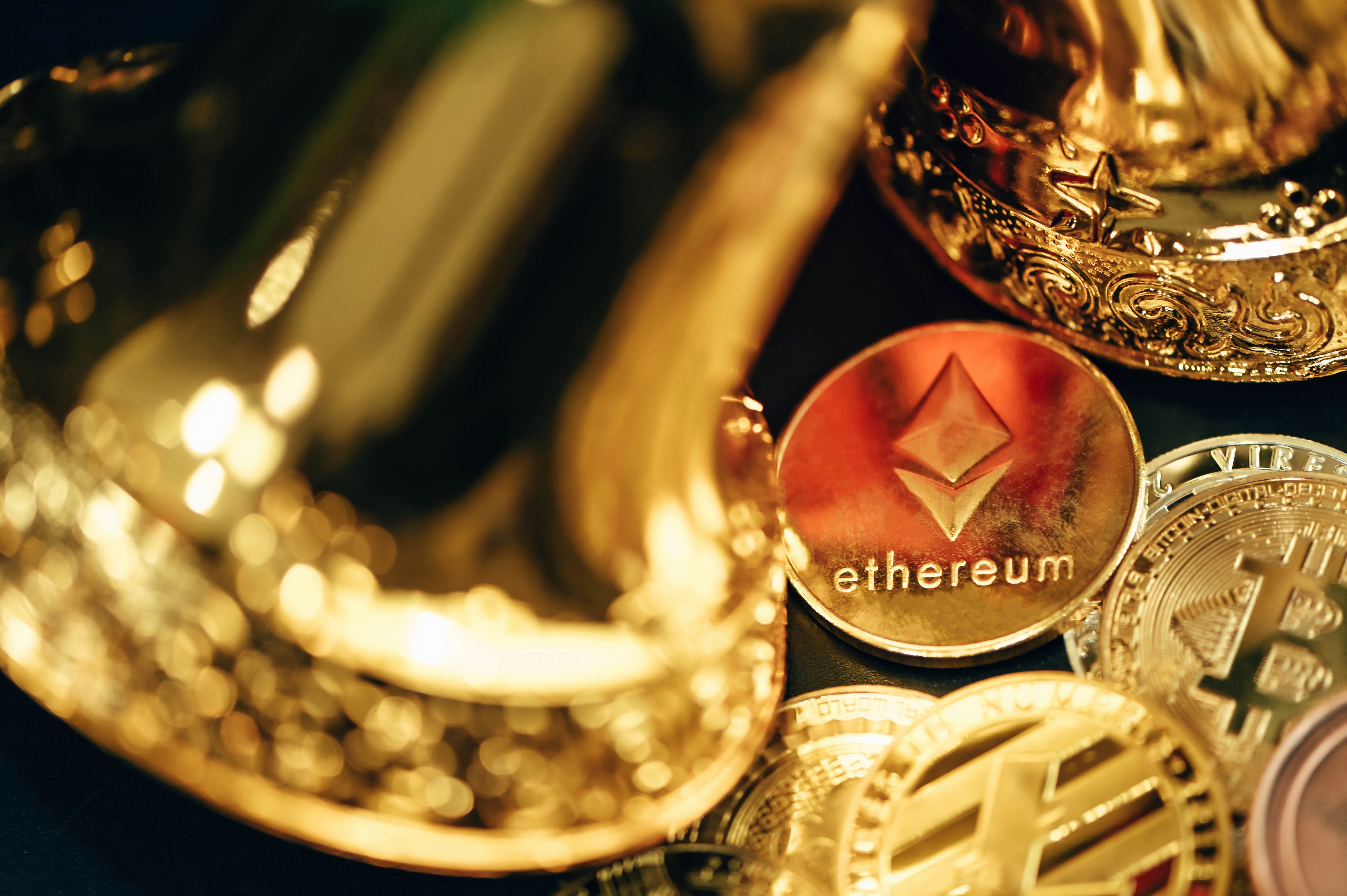 A pile of cryptocurrency coins in the middle of the gold bells