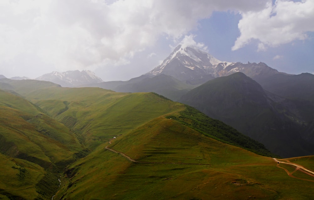 a view of a mountain range with a road going through it