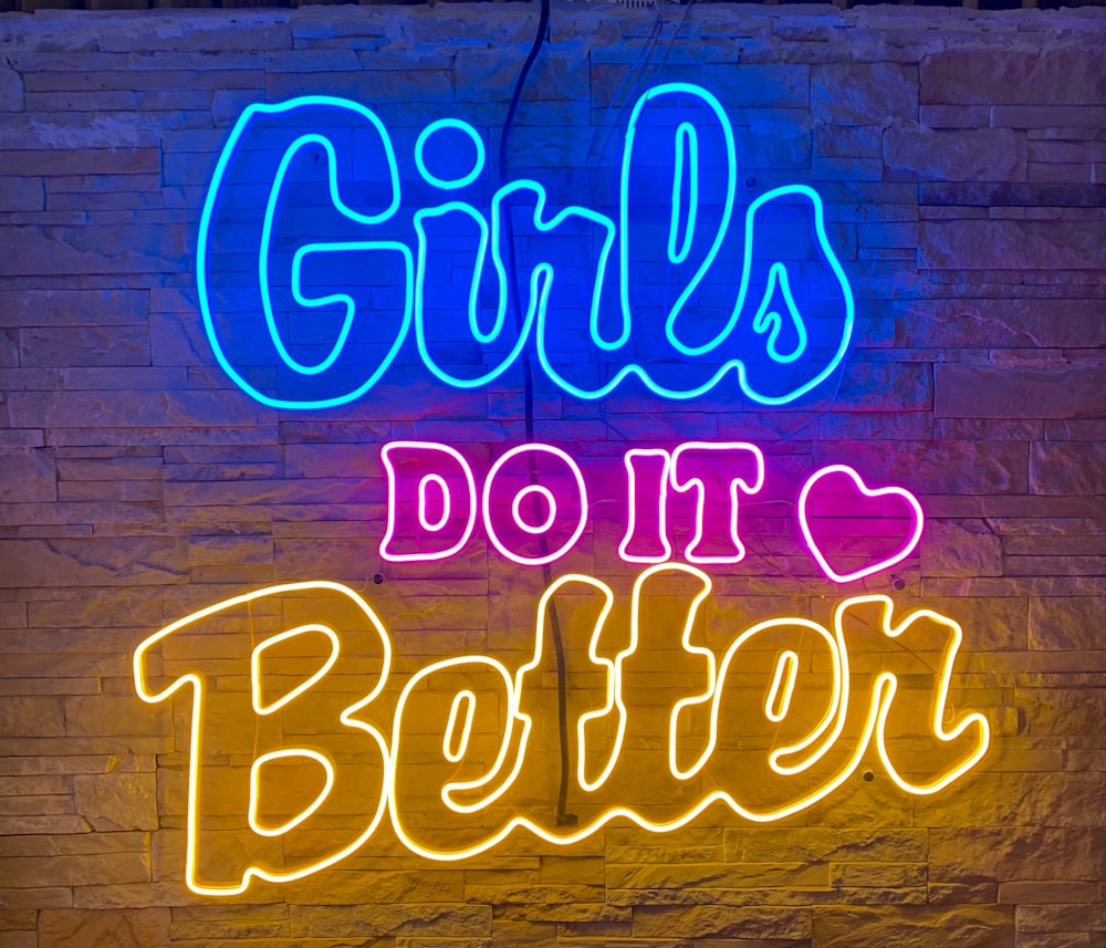 a neon sign that says girls do it better