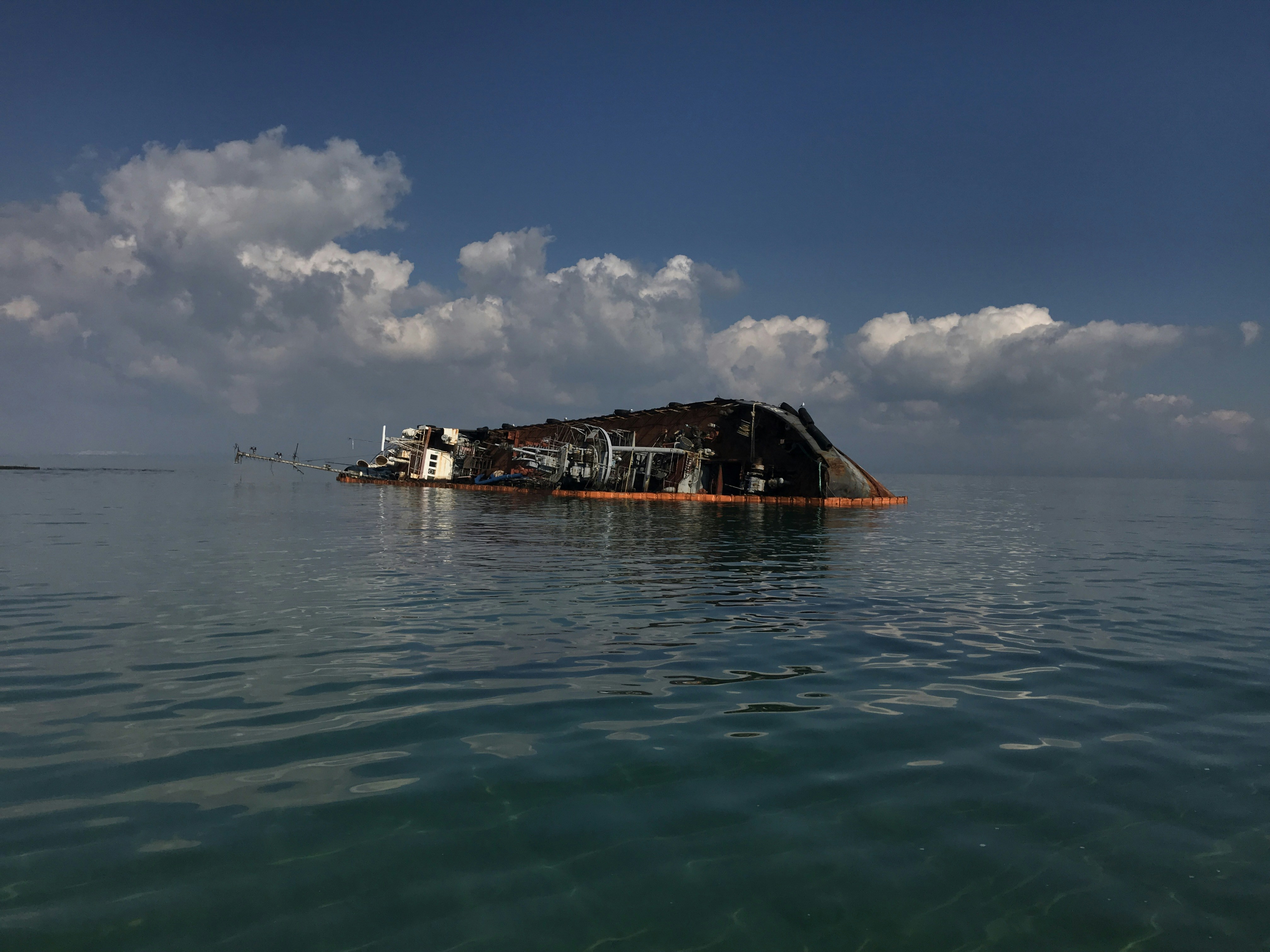 a large boat floating on top of a body of water