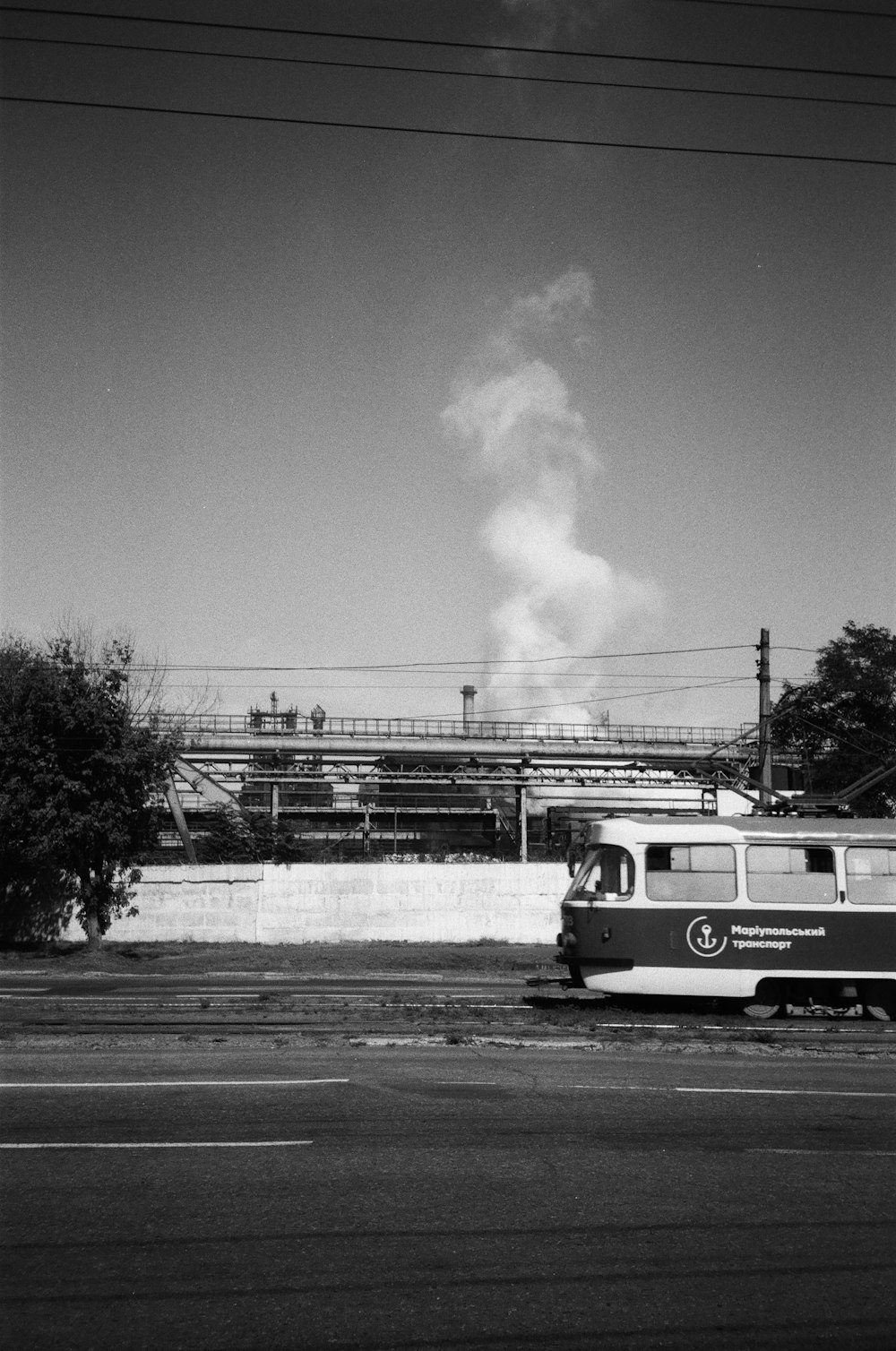 a black and white photo of a train on the tracks