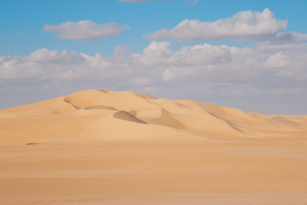 a large sand dune in the middle of a desert