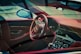 the interior of a car with a steering wheel and dashboard