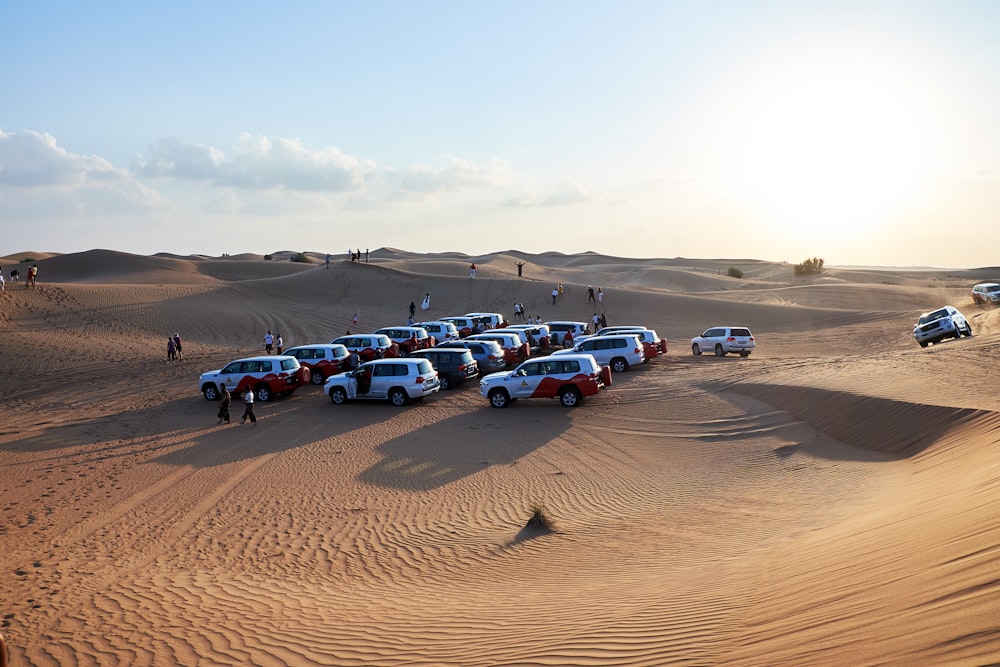 a group of trucks parked in the desert