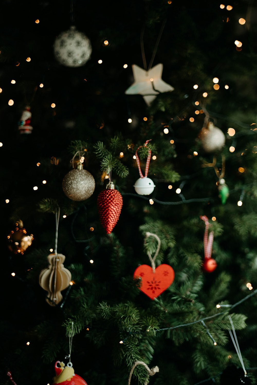 a christmas tree with ornaments hanging from it