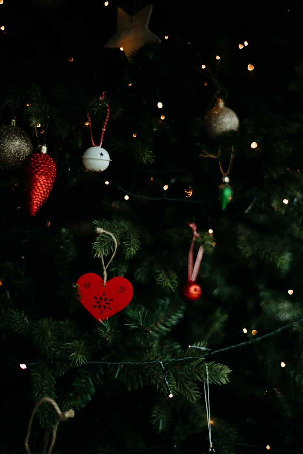 a christmas tree with ornaments hanging from it