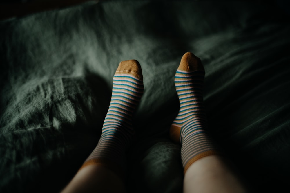 a woman's legs with blue and white striped socks