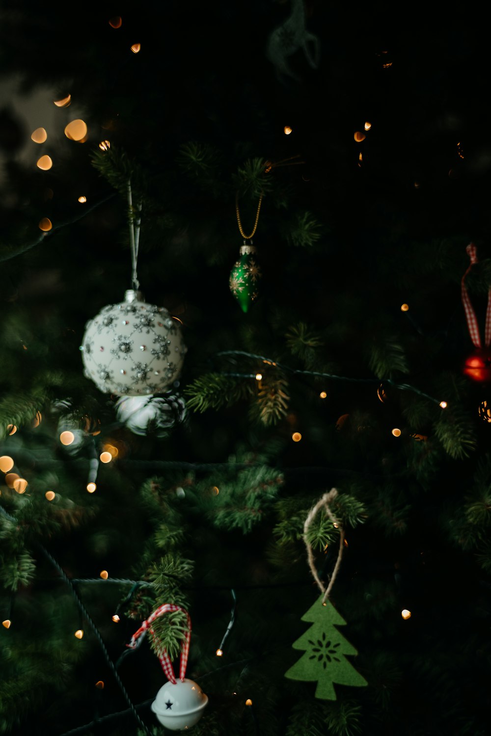 a christmas tree with ornaments hanging from it