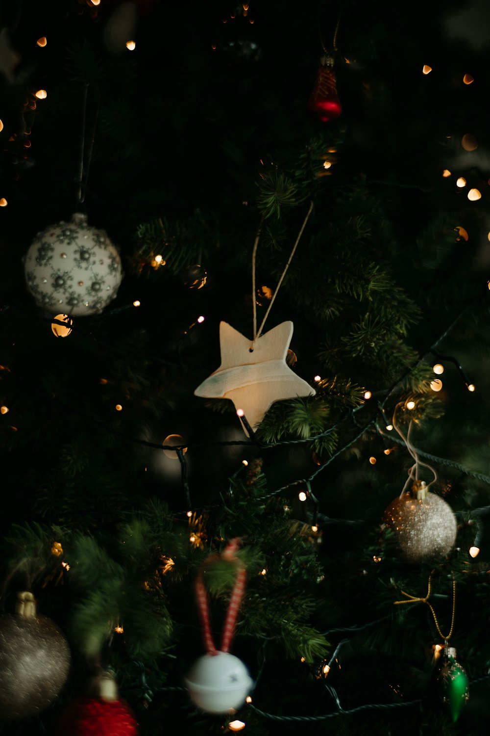 a close up of a christmas tree with ornaments