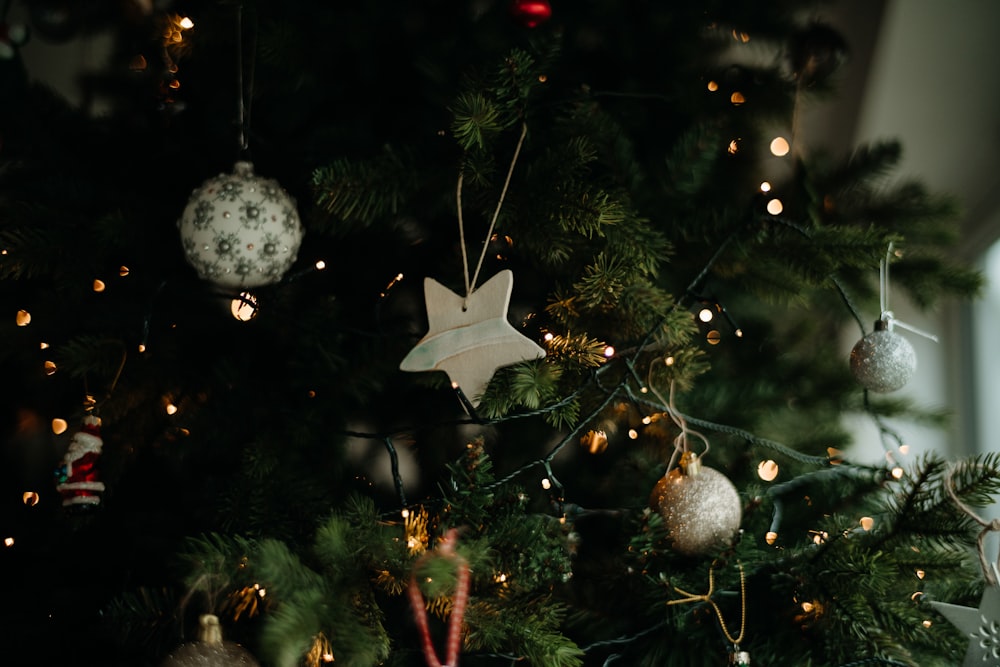 a close up of a christmas tree with ornaments