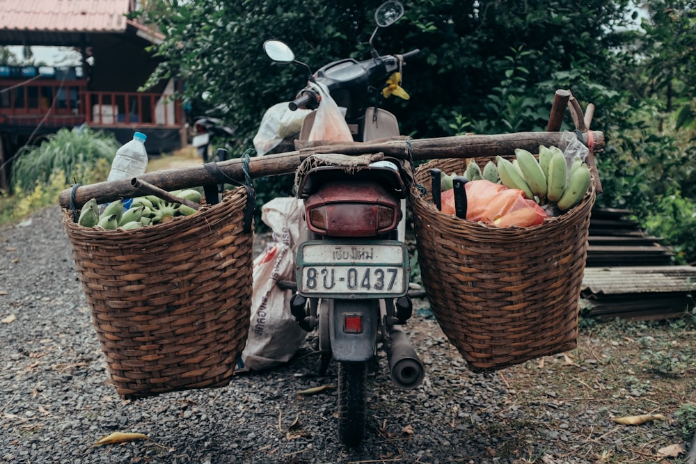 a motorcycle with two baskets on the back of it