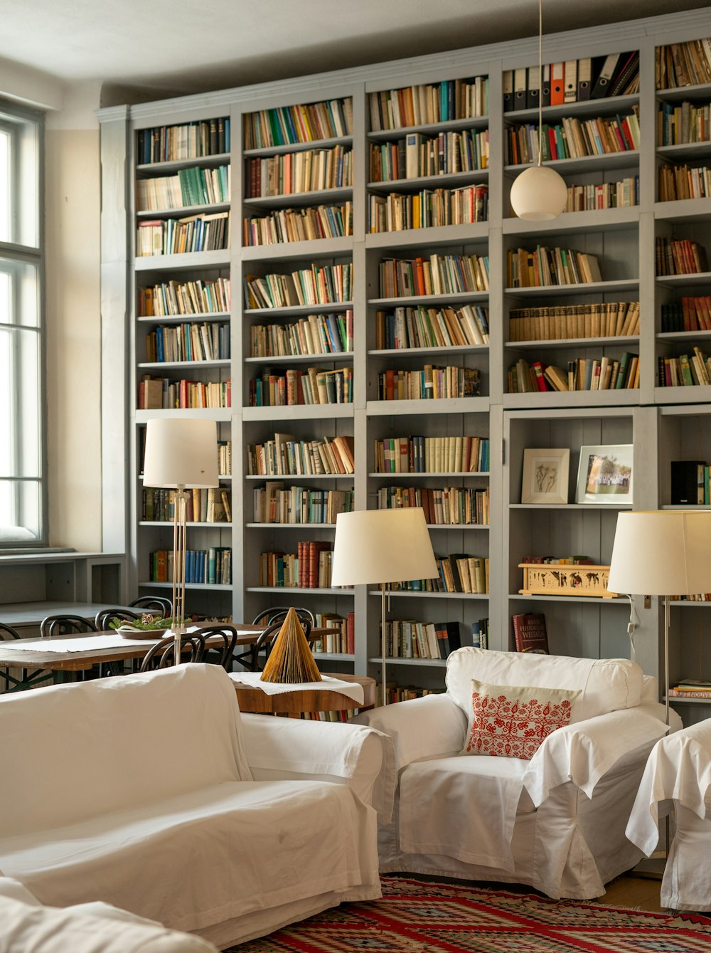a living room filled with lots of books