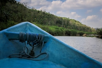 A serene morning view of the Amazon river with a fishing boat ready for departure.