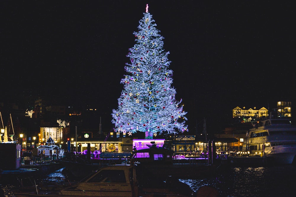 a large christmas tree lit up at night