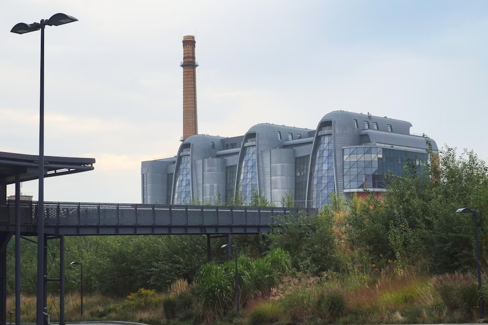 a large factory building sitting on the side of a road