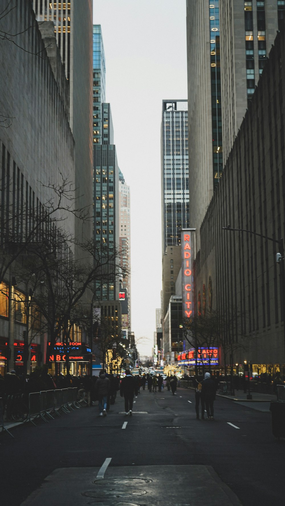 a city street filled with lots of tall buildings